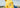 Homme portant un pull marin uni jaune de la collection Royal Mer x Guy Cotten.