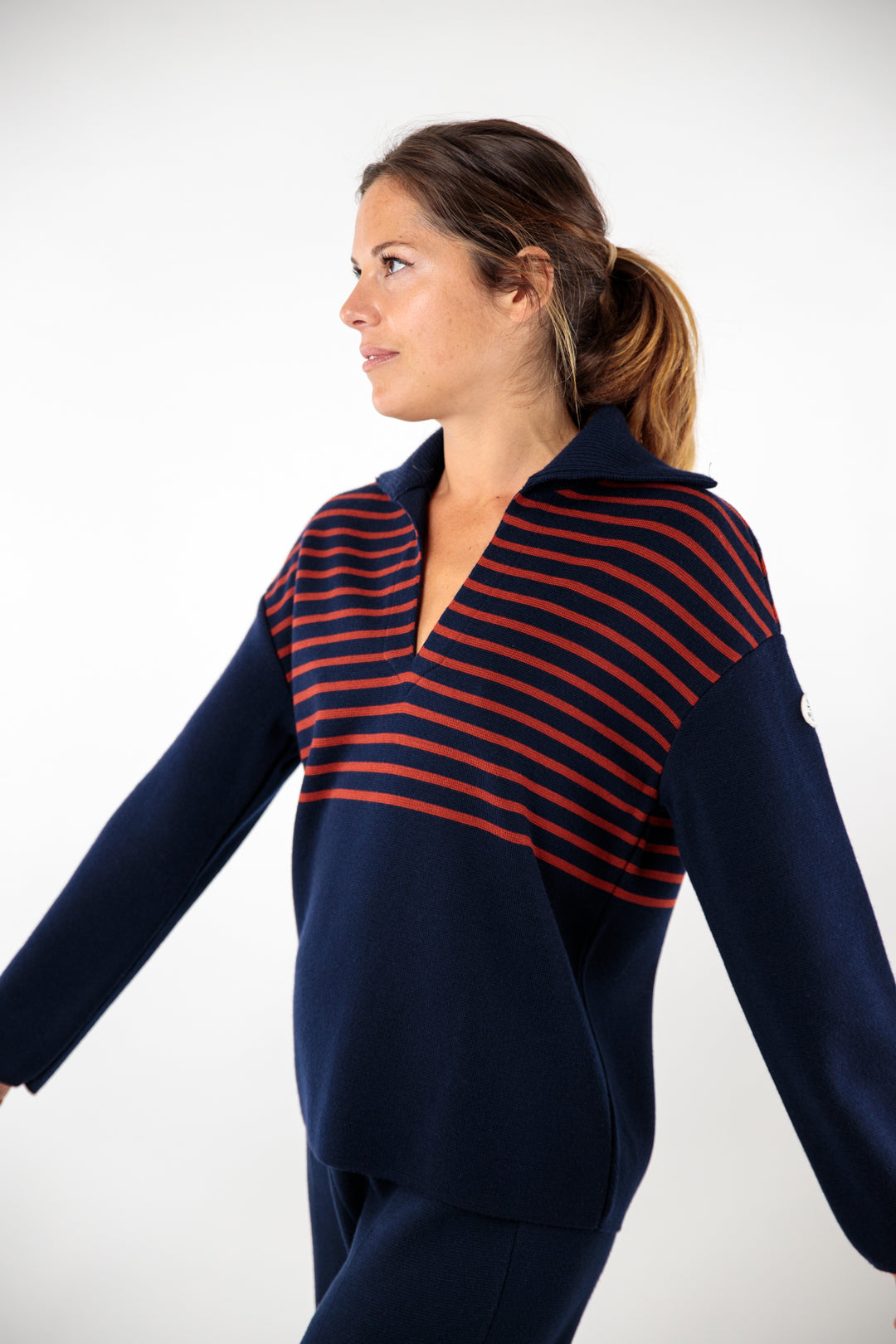 Two-tone striped sweater with peacock collar