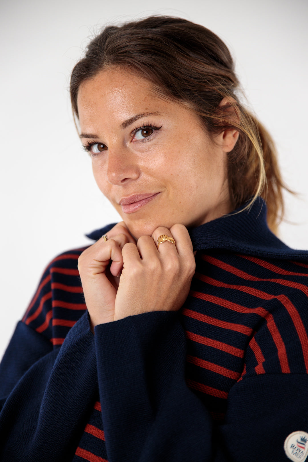 Two-tone striped sweater with peacock collar