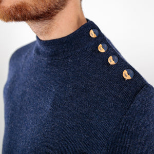 Pull marin uni coudières fantaisies